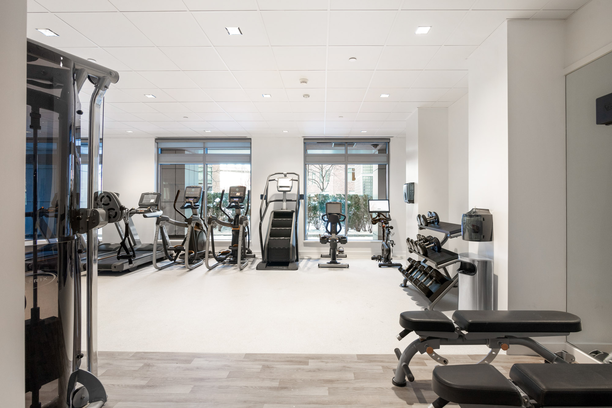 Fitness center equipment at 100 Landsdowne Street Apartments