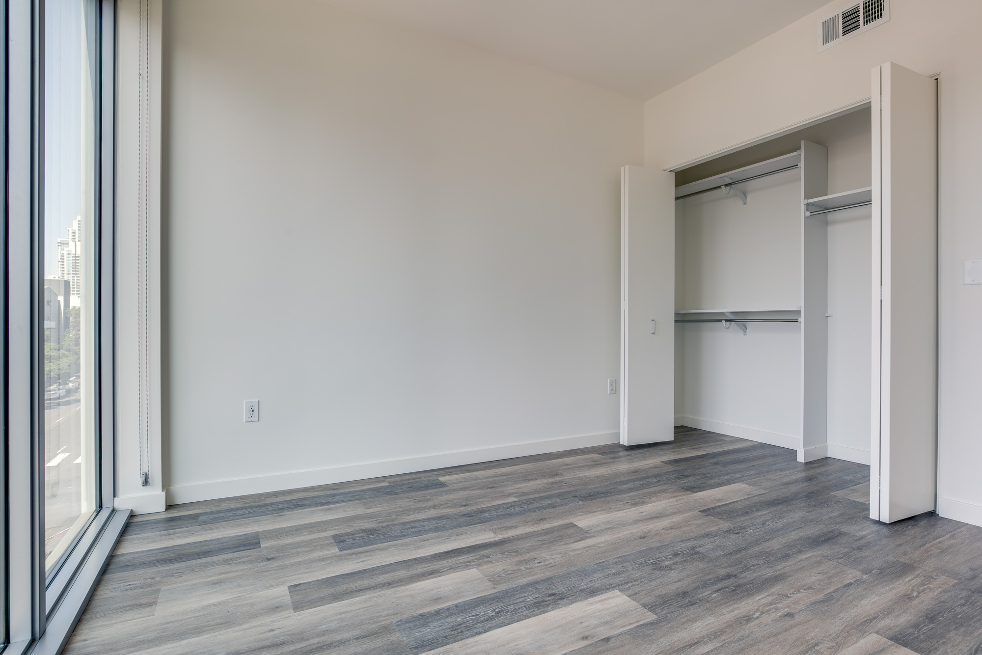 Bedroom space at The Merian Apartments in San Diego, California.