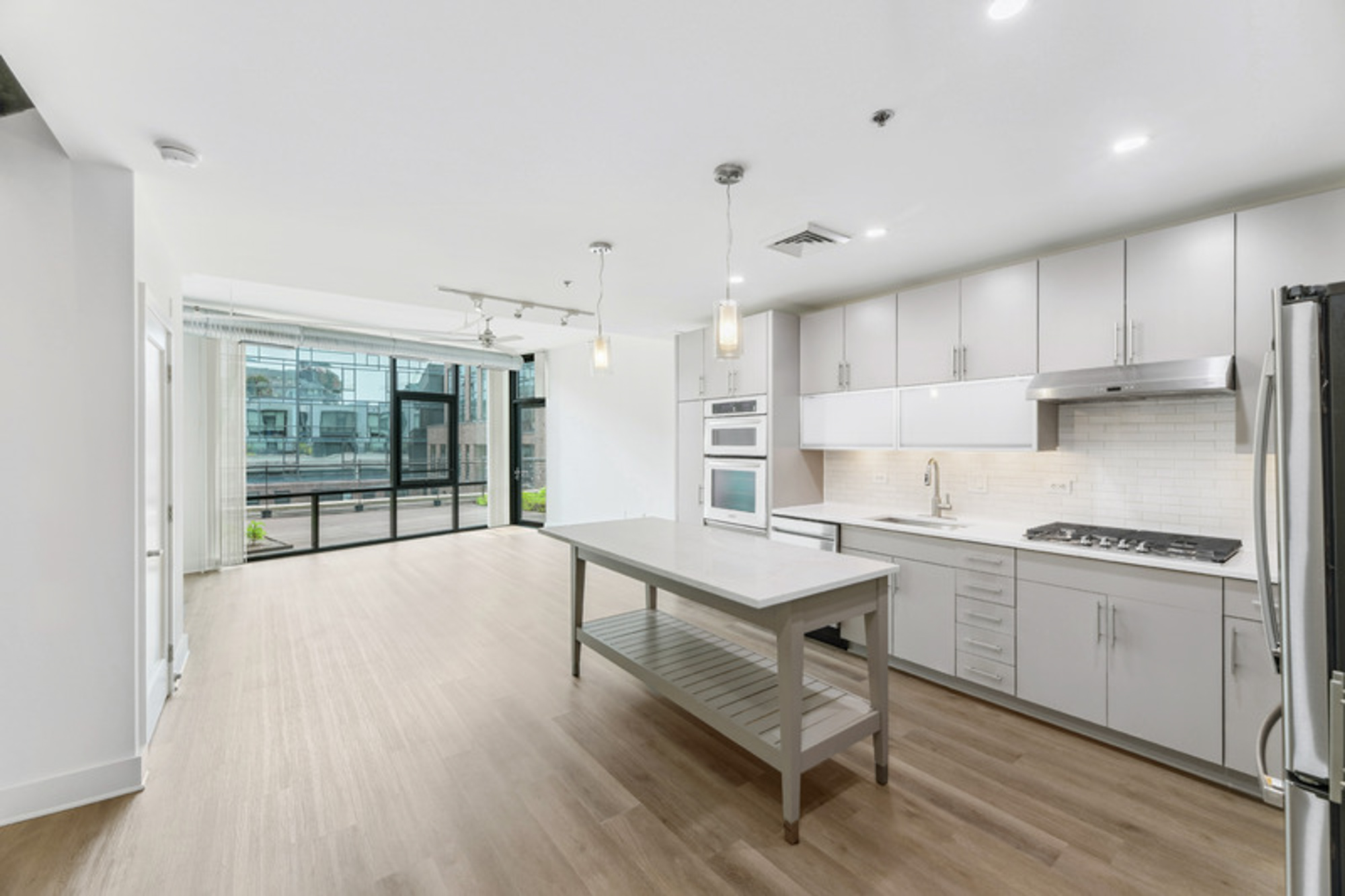 The kitchen and living room in a Foundry Lofts apartment in Washington, D.C.